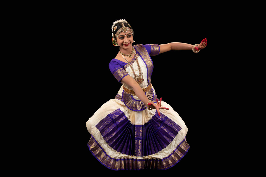A girl bharatanatyam dancing on the stage on Craiyon